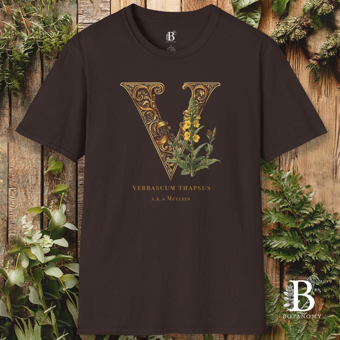 Black t-shirt with decorative 'V' design and plant elements on a wooden background