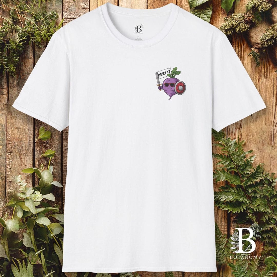 White t-shirt with a graphic design on a wooden background with plants