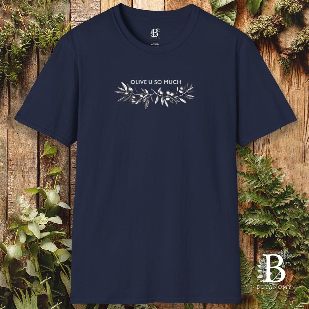 Navy blue t-shirt with 'Olive U So Much' text and olive branch design on a wooden background with greenery.