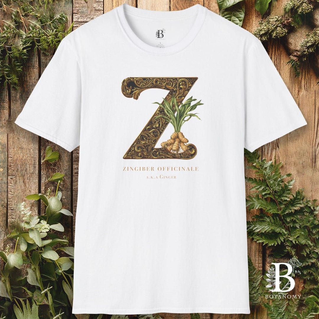 White t-shirt with a decorative 'Z' design on a wooden background