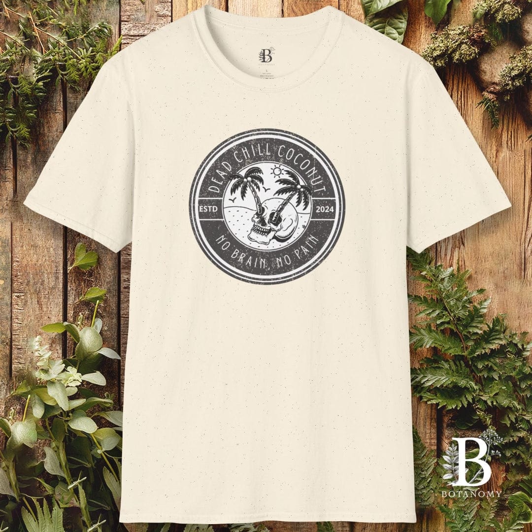 Beige t-shirt with a black circular logo on a wooden background with greenery