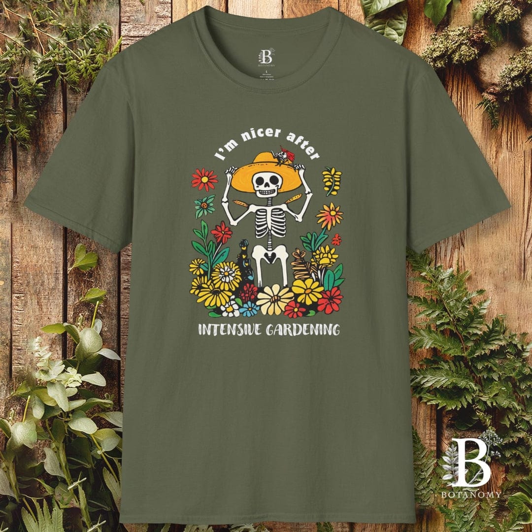 Green t-shirt with skeleton and floral design on a wooden background