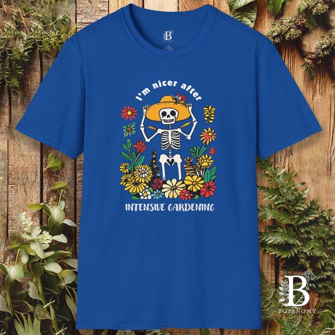 Blue t-shirt with a skeleton and flowers design on a wooden background