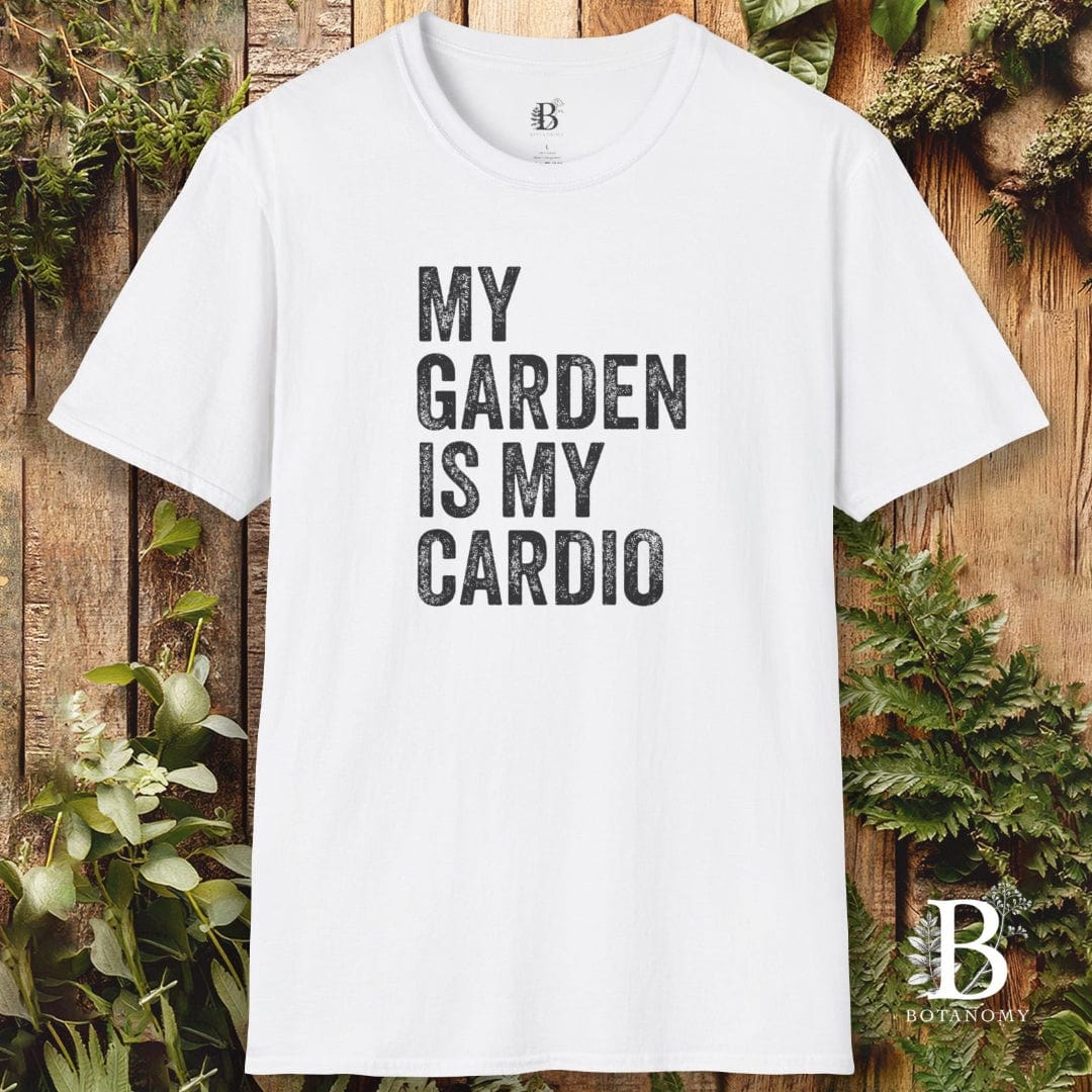White t-shirt with 'My Garden is My Cardio' text on a wooden background with plants
