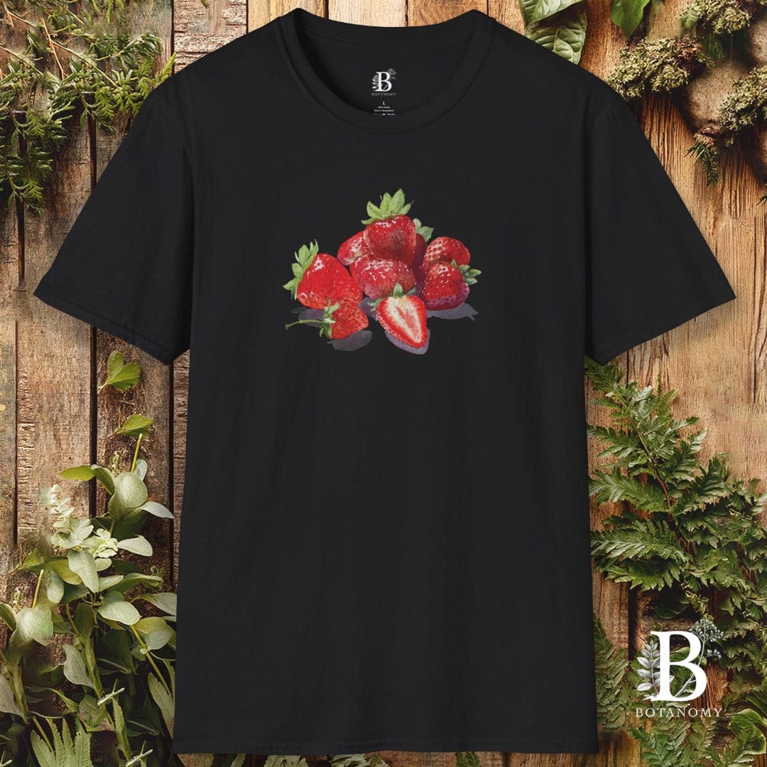 Black t-shirt with strawberry design on a wooden background