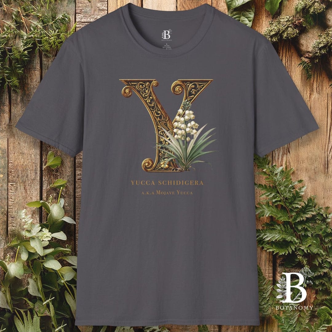 Gray t-shirt with decorative letter 'Y' design on a wooden background with plants