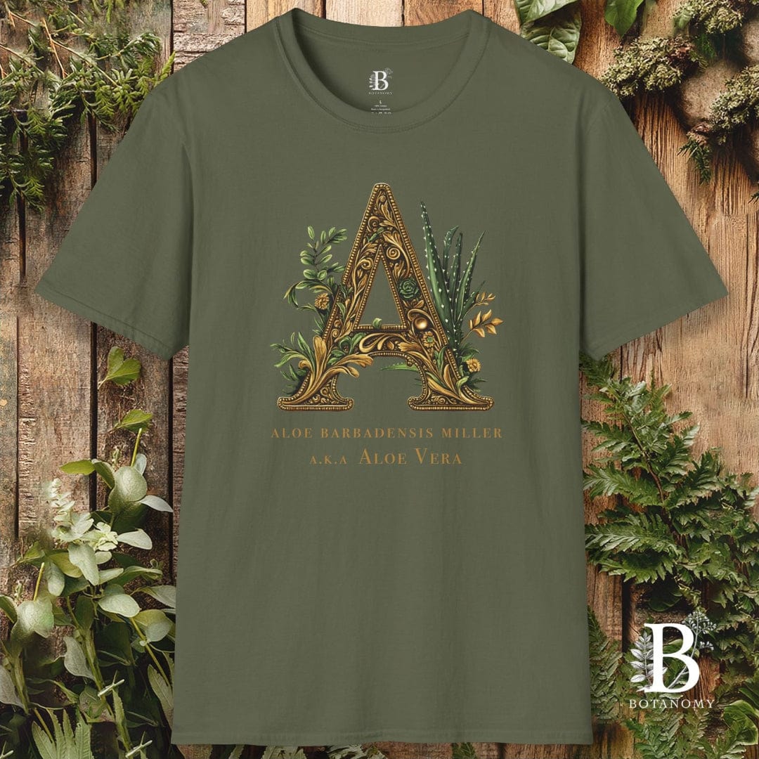 Green t-shirt with decorative letter 'A' design on a wooden background