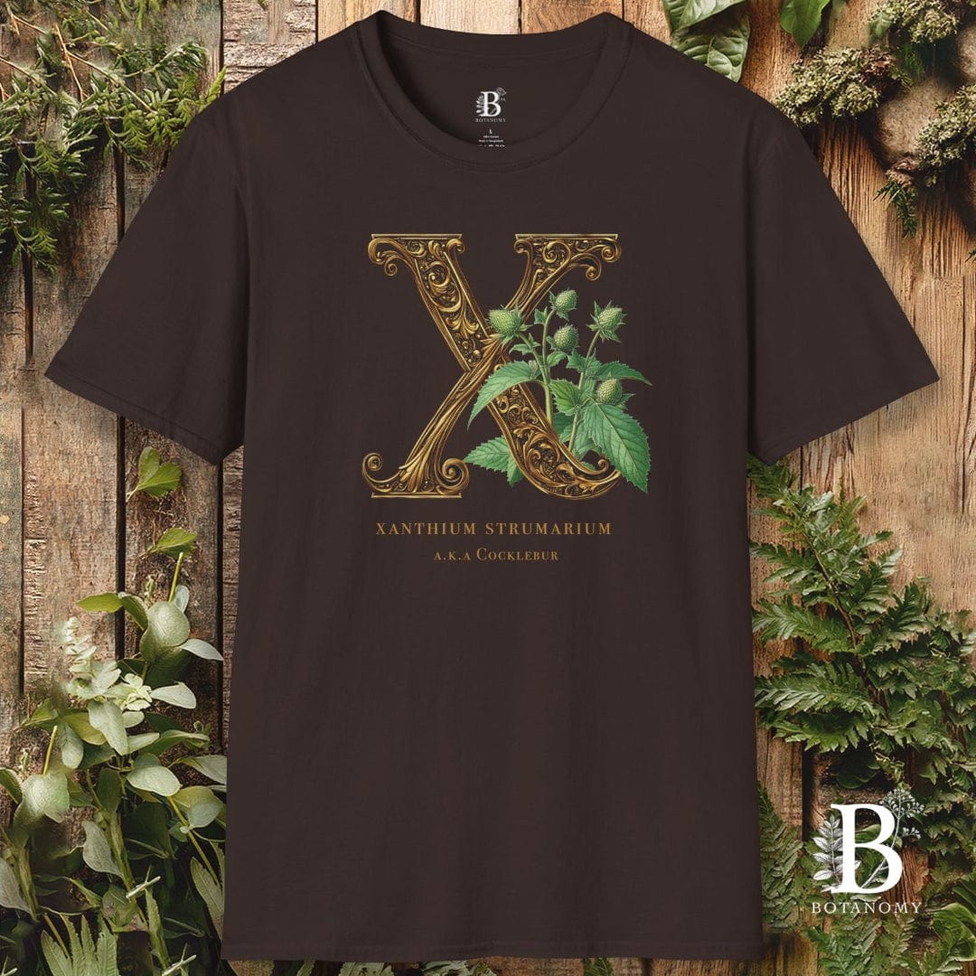 Black t-shirt with decorative letter 'X' design on a wooden background
