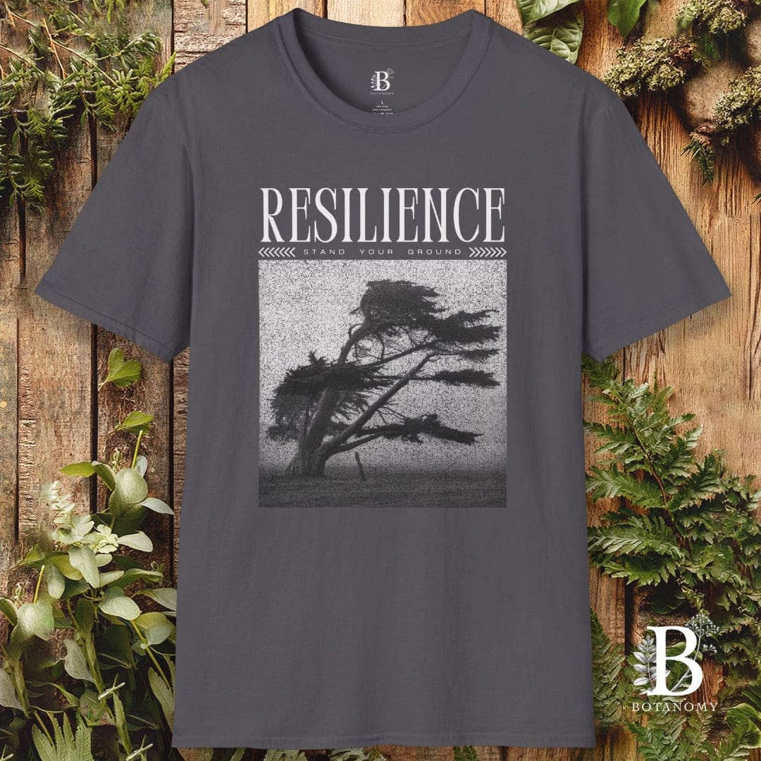 Gray t-shirt with 'Resilience' graphic and tree design on a wooden background