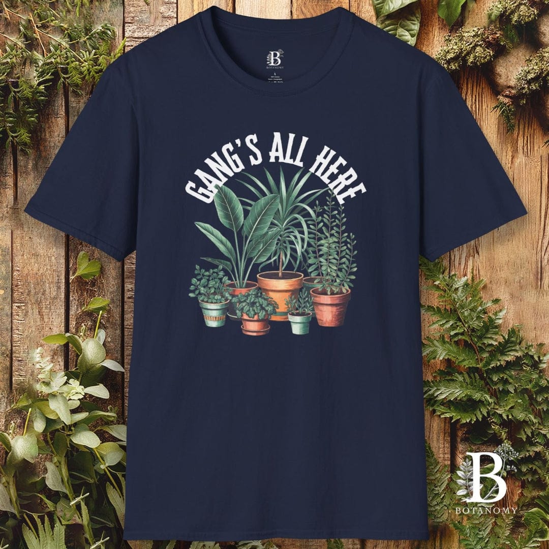 Navy blue t-shirt with plant graphic and text 'Gangs All Here' on a wooden background