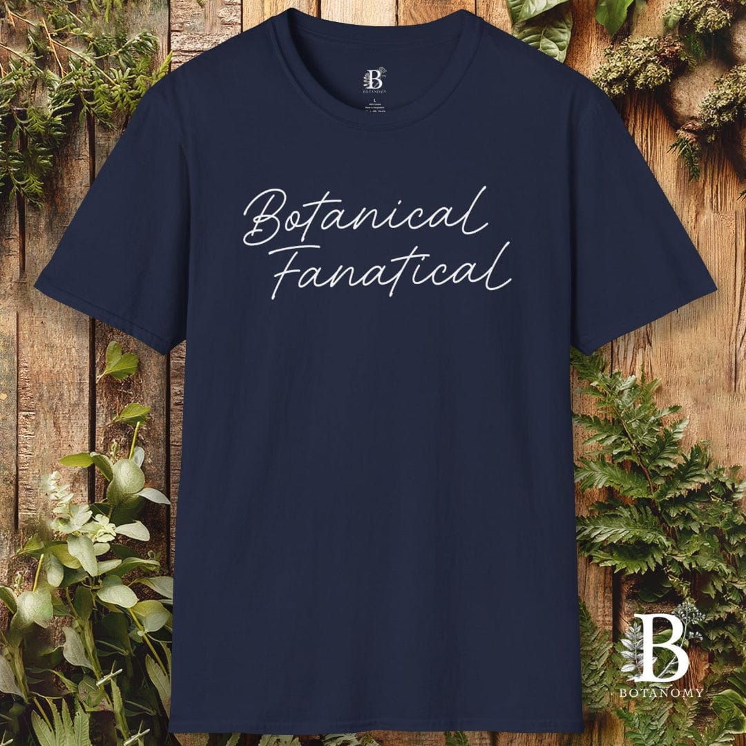 Navy blue t-shirt with 'Botanical Fanatical' text on a wooden background with plants
