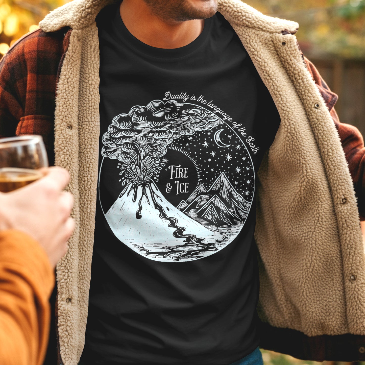 Man wearing black t-shirt with text "Fire & ice" and volcano and ice glacier graphic design.