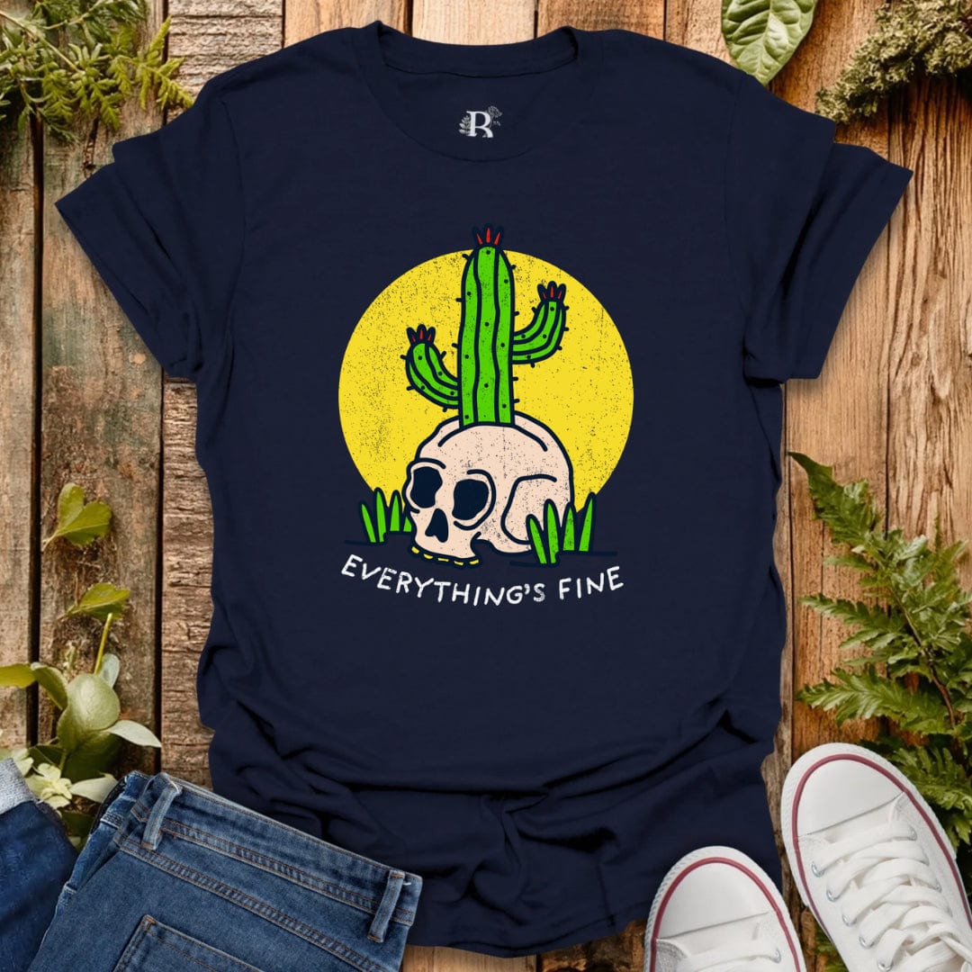 Navy blue t-shirt with a skull and cactus design and 'Everything's Fine' text on a wooden surface.