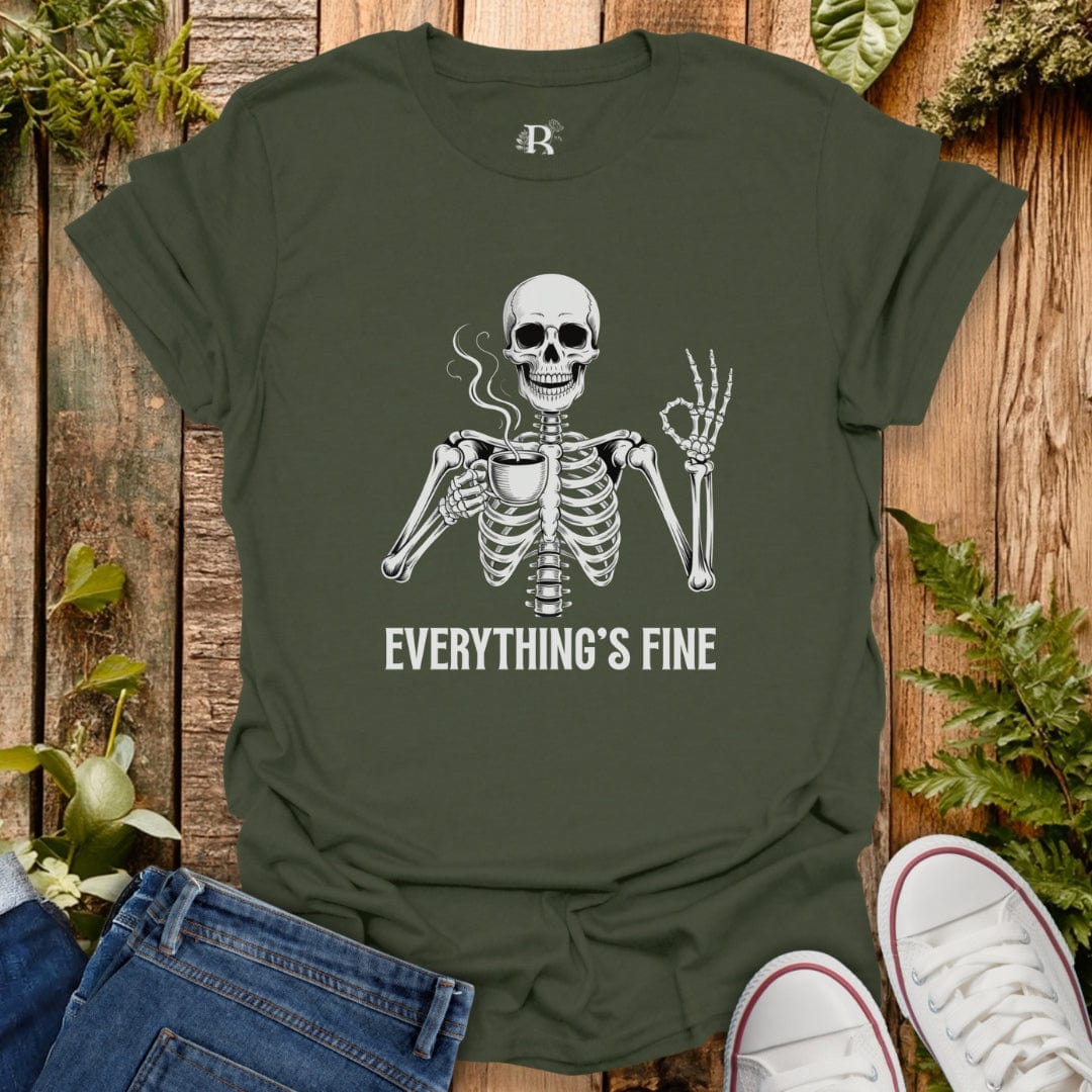 Green t-shirt with skeleton graphic and 'Everything's Fine' text on a wooden background