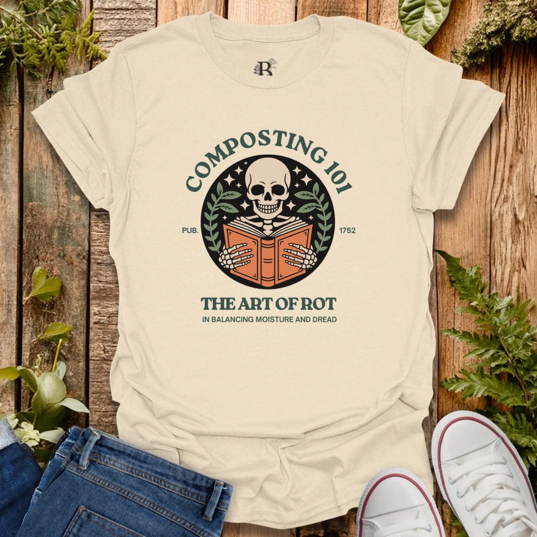 Beige t-shirt with composting graphic design on a wooden background with plants.