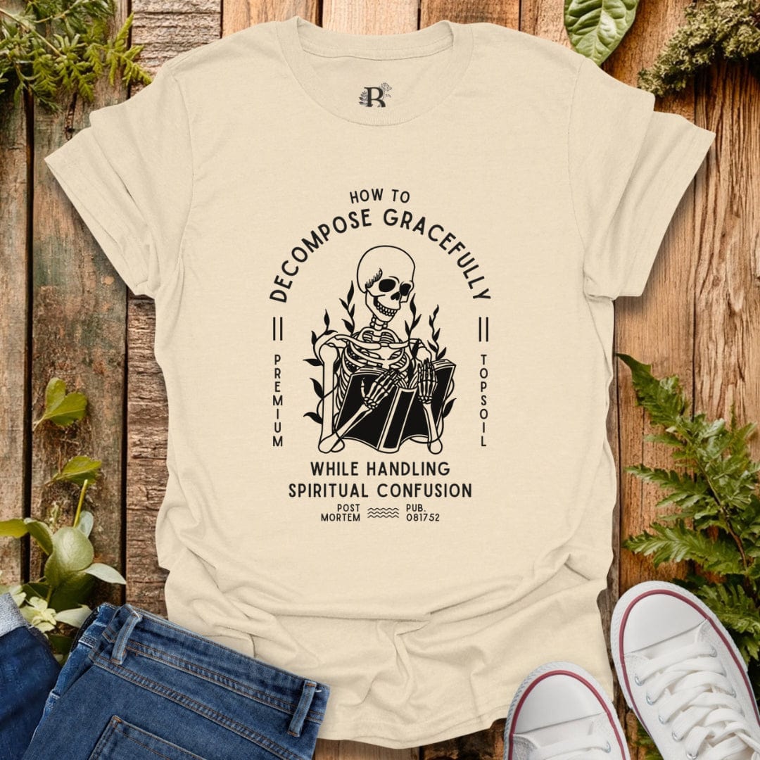 Beige t-shirt with a graphic design on a wooden background