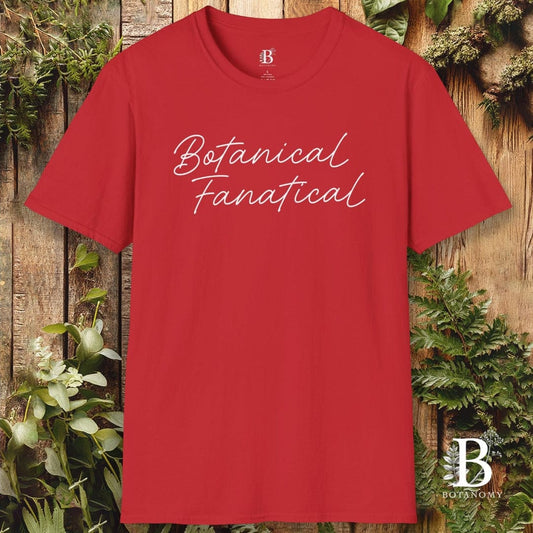 Red t-shirt with 'Botanical Fanatical' text on a wooden background with plants