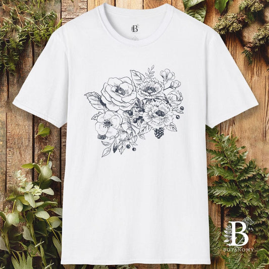 White t-shirt with floral design on a wooden background