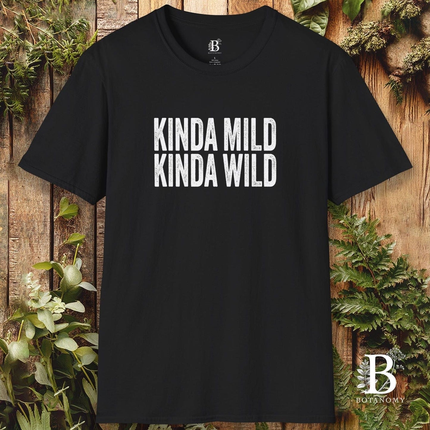 Black t-shirt with 'KINDA MILD KINDA WILD' text on a wooden background