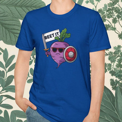 Person wearing a blue t-shirt with a graphic design of a beet wearing sunglasses and a hat, with text 'BEET IT'.