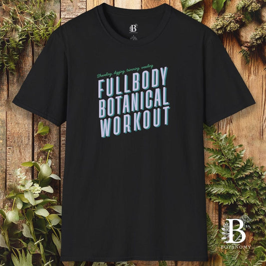 Black t-shirt with 'Fullbody Botanical Workout' text on a wooden background with plants