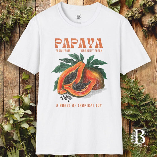White t-shirt with papaya graphic and text on a wooden background