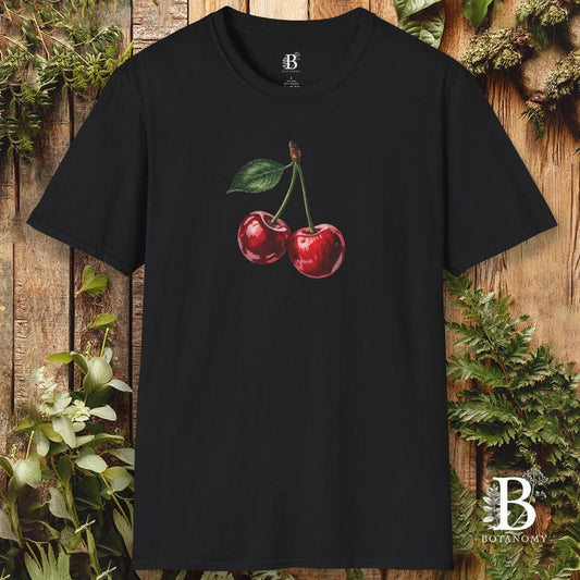 Black t-shirt with cherry design on a wooden background