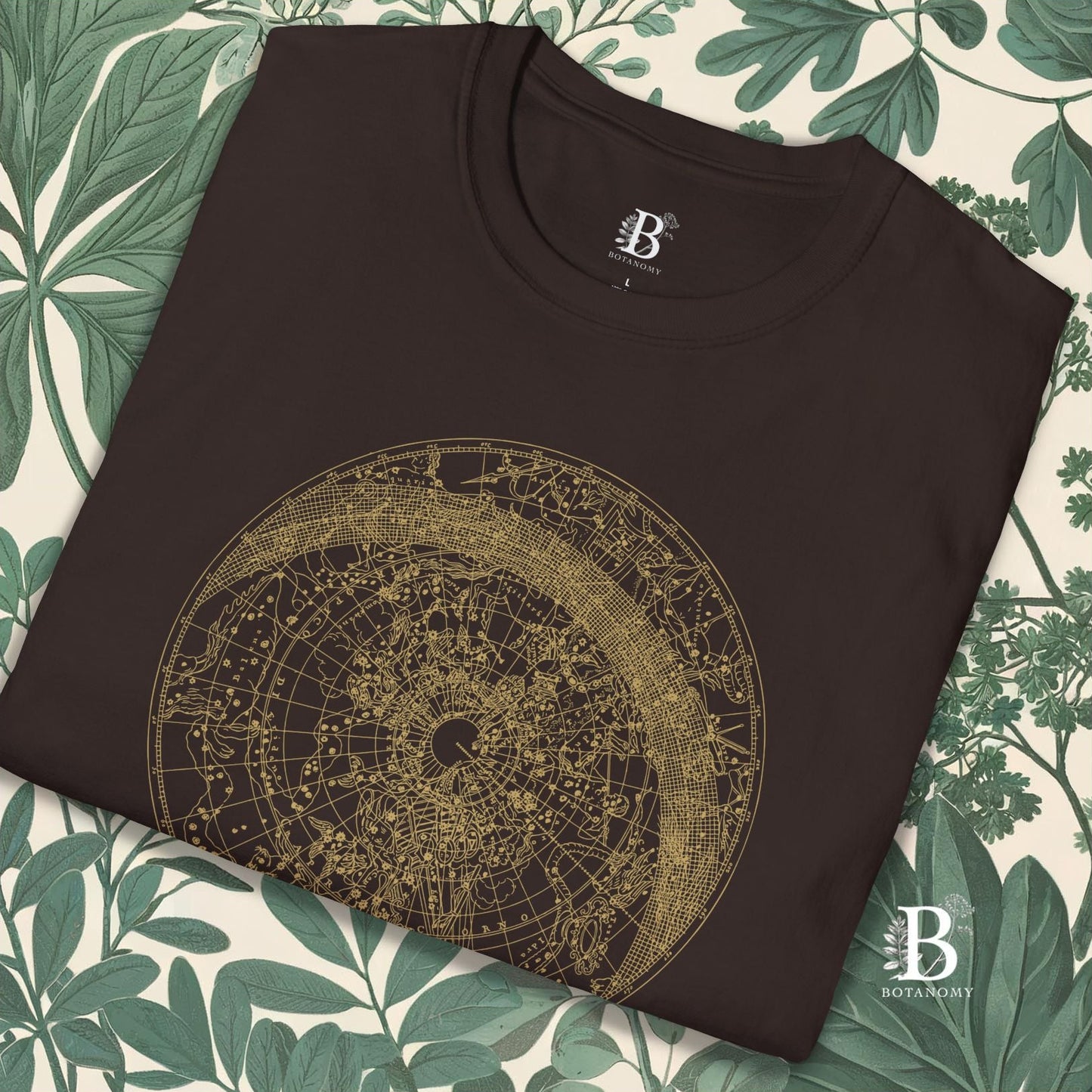 close up of folded brown t-shirt with constellation graphic design.