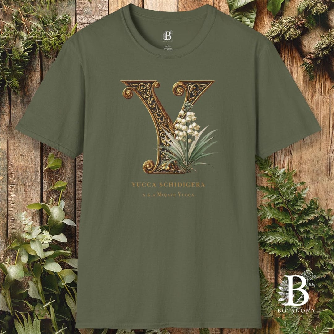 Green t-shirt with decorative letter 'Y' design on a wooden background
