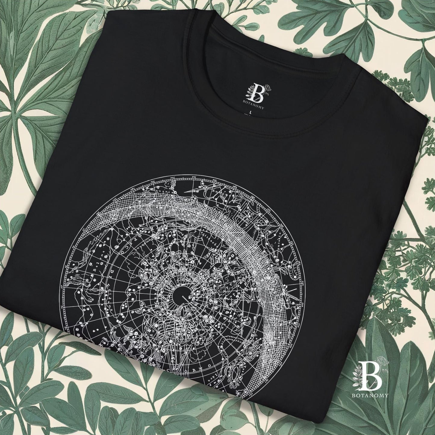 Black folded up close up of t-shirt with constellation graphic design.