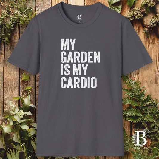 Gray t-shirt with 'My Garden is My Cardio' text on a wooden background with plants