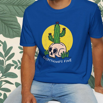 Man wearing a blue t-shirt with a graphic design and text, sitting against a white background.