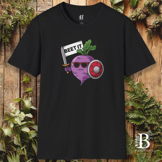 Black t-shirt with a graphic of a beet wearing sunglasses and holding a sign that says 'BEET IT' on a wooden background.