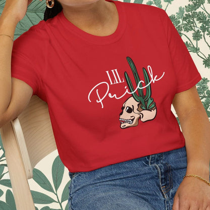 Person wearing a red t-shirt with a graphic design sitting on a chair.