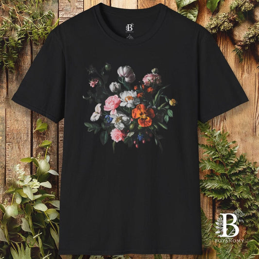 Black t-shirt with floral design on a wooden background