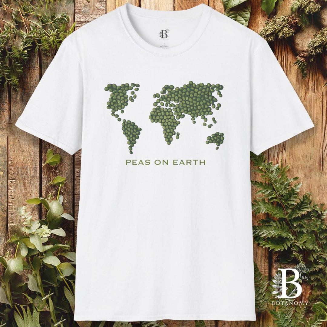 White t-shirt with pea world map design on a wooden background