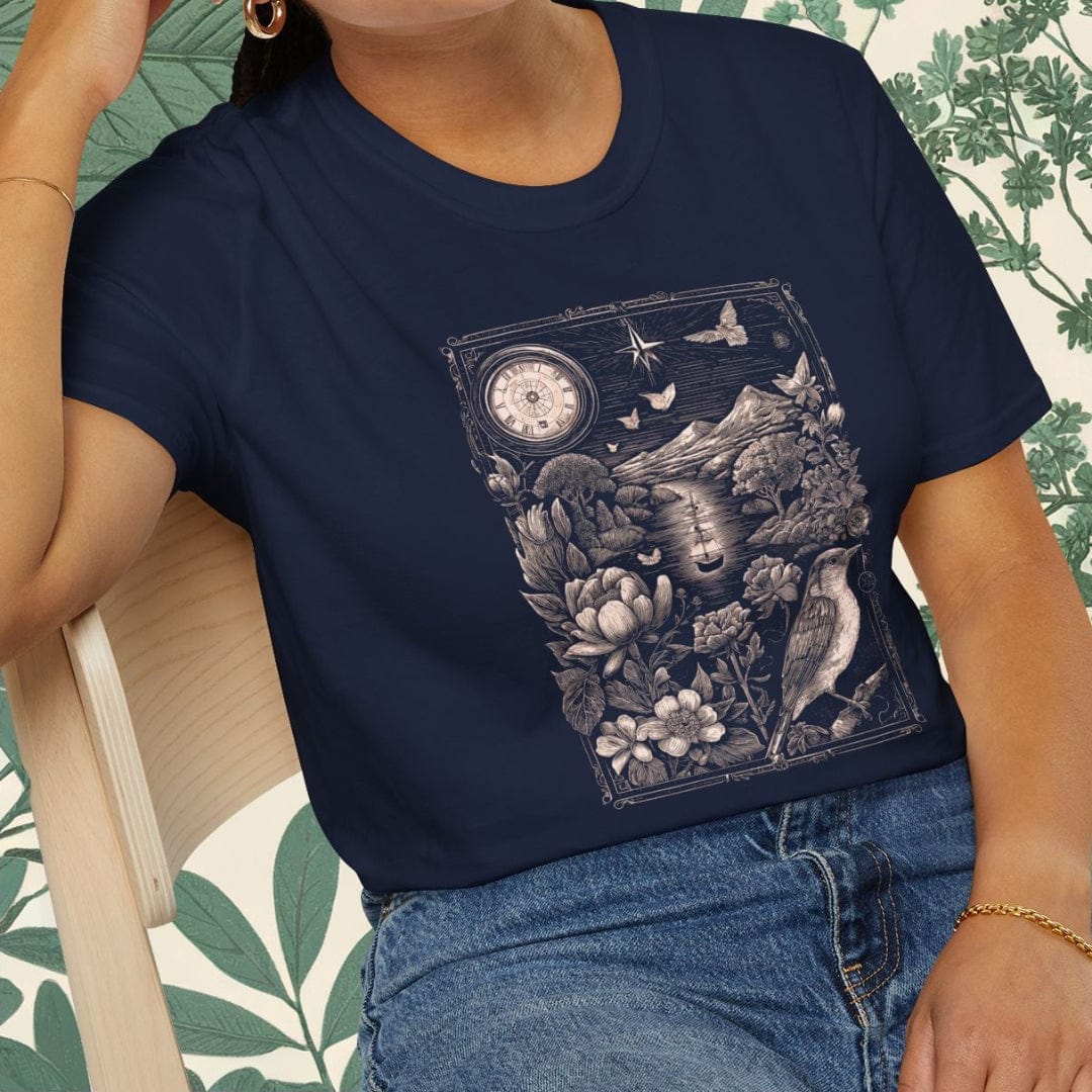 Woman wearing a navy blue t-shirt with a graphic design, sitting on a chair with a floral patterned background.