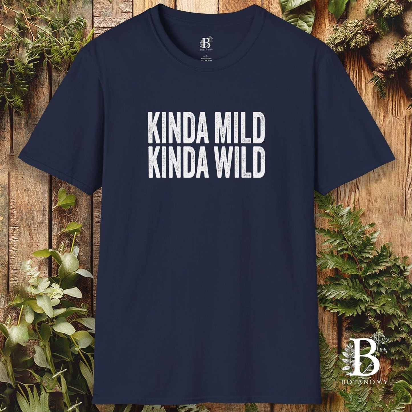 Navy blue t-shirt with 'KINDA MILD KINDA WILD' text on a wooden background
