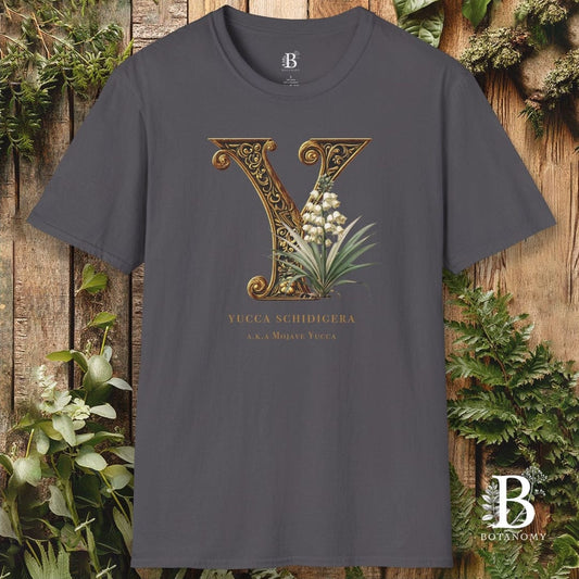 Gray t-shirt with decorative letter 'Y' design on a wooden background with plants