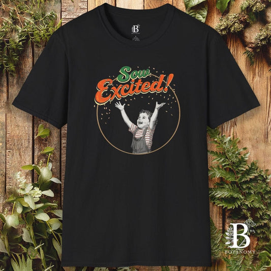 Black t-shirt with 'So Excited!' graphic design on a wooden background