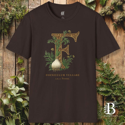 Brown t-shirt with decorative letter 'F' design featuring an onion, against a wooden background with plants.