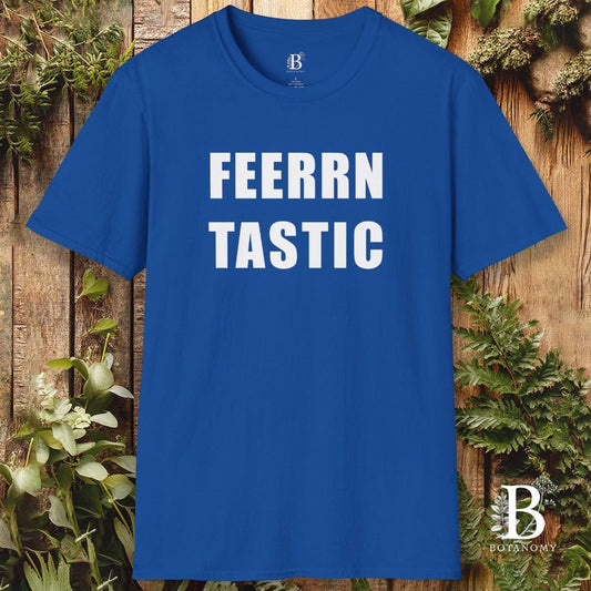 Blue t-shirt with 'FEERRN TASTIC' text on a wooden background