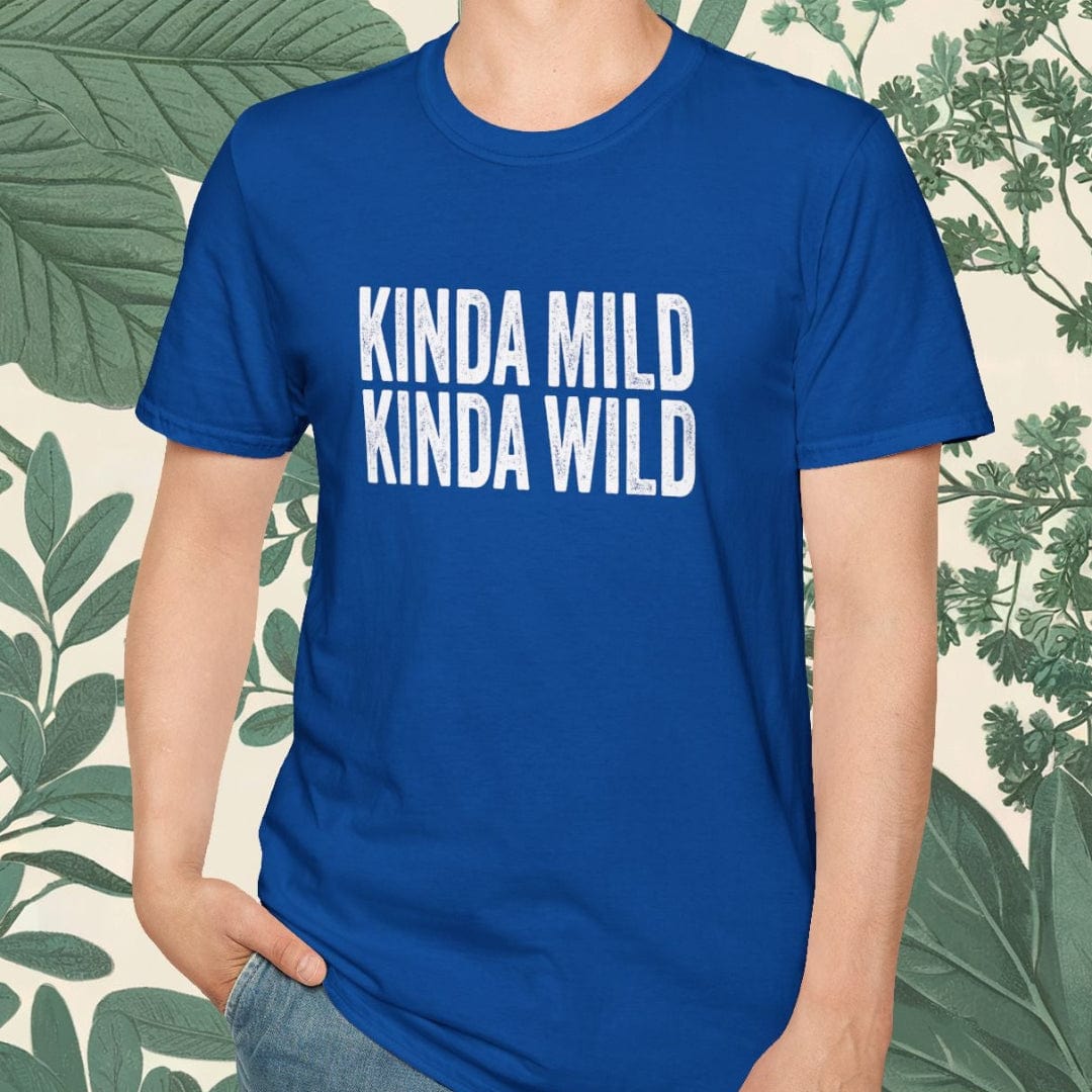 Person wearing a blue t-shirt with 'KINDA MILD KINDA WILD' text, standing against a leafy background.