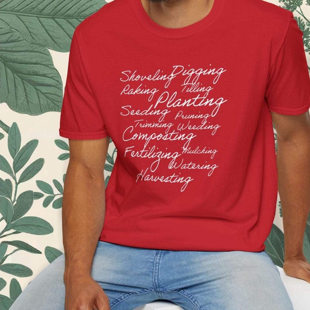 Man wearing a red t-shirt with text design, sitting on a white stool against a white background.