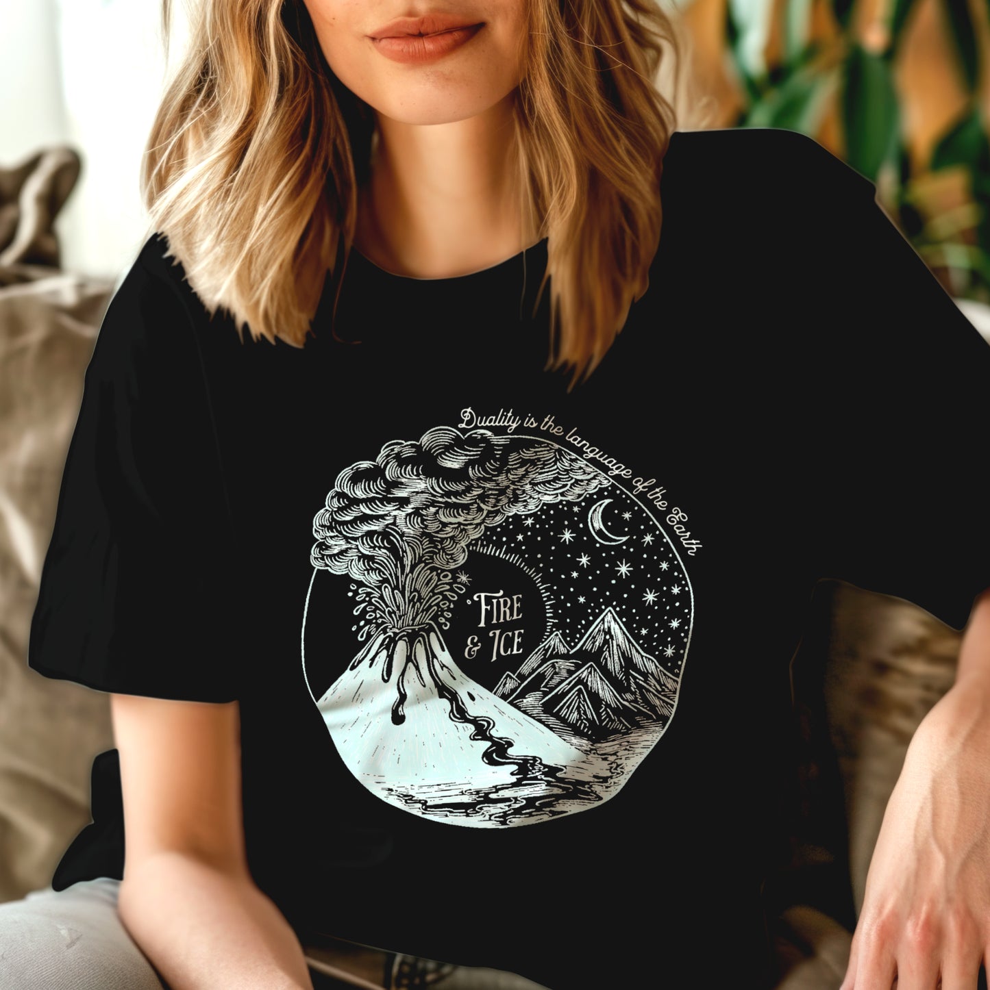 Woman wearing black t-shirt with text "Fire & ice" and volcano and ice glacier graphic design.