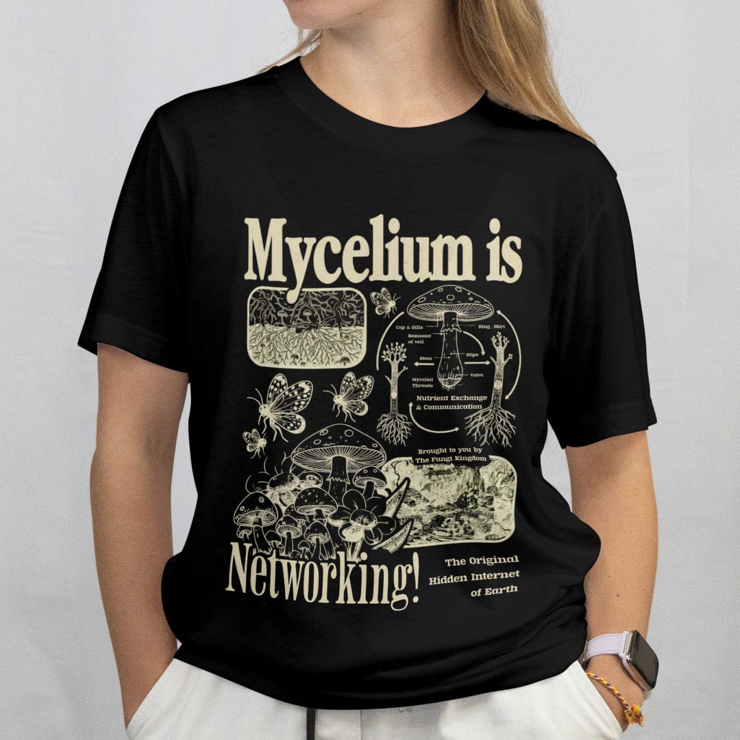 woman wearing a black t-shirt with Mycelium is Networking text and mushroom graphics.