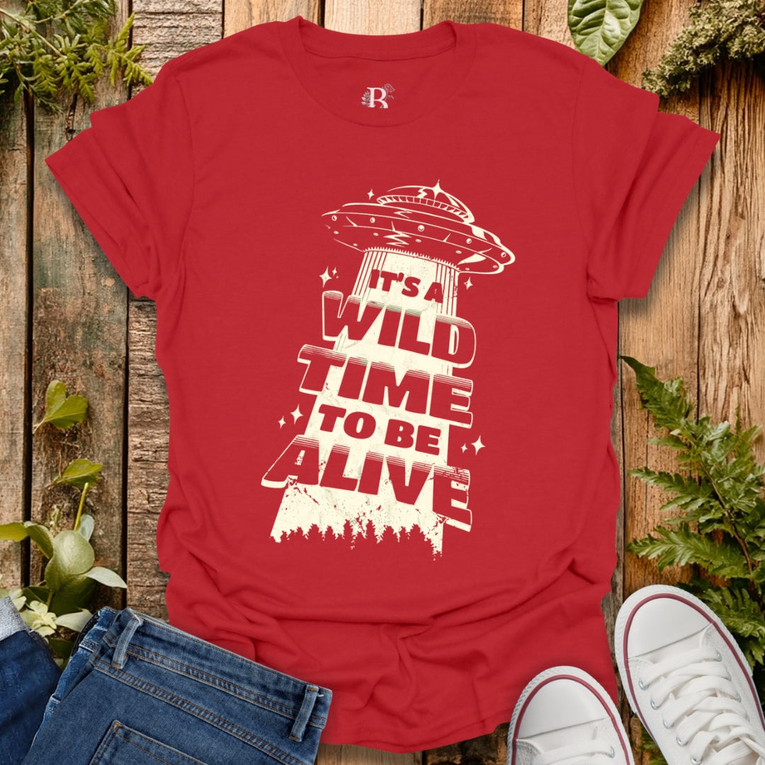 Red T-shirt with UFO graphic design.