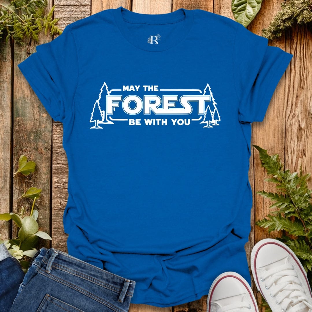 Blue t-shirt with 'May the Forest Be With You' text on a wooden background