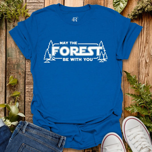 Blue t-shirt with 'May the Forest Be With You' text on a wooden background