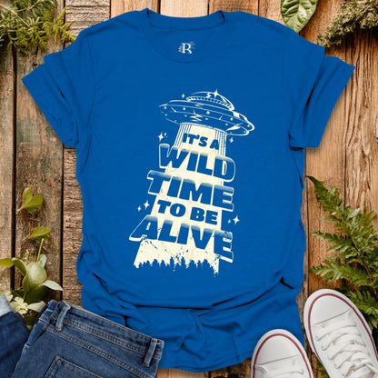 Blue T-shirt with UFO graphic design.